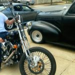 Tattoo Vic on his Chopper next to CJ's 40 Chevy